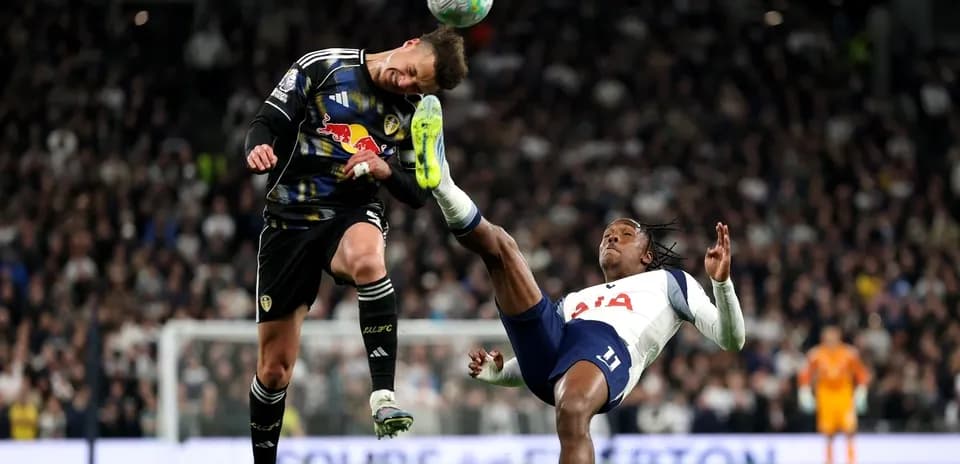 Goalkeeper colliding with player during match action
