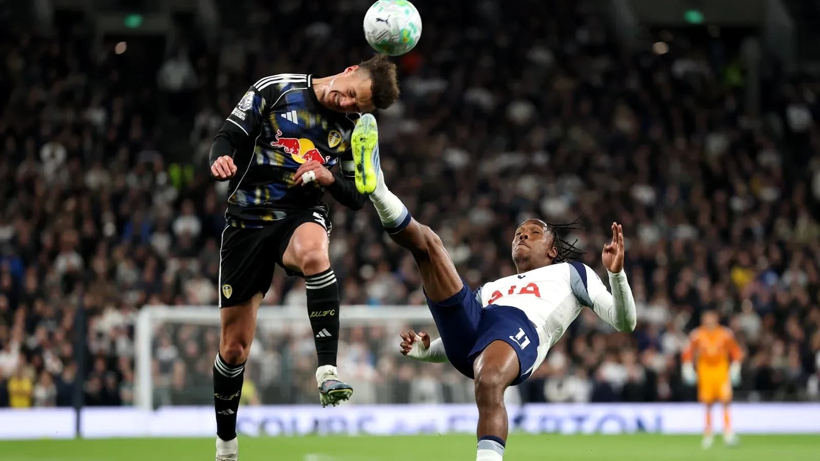 Goalkeeper colliding with player during match action