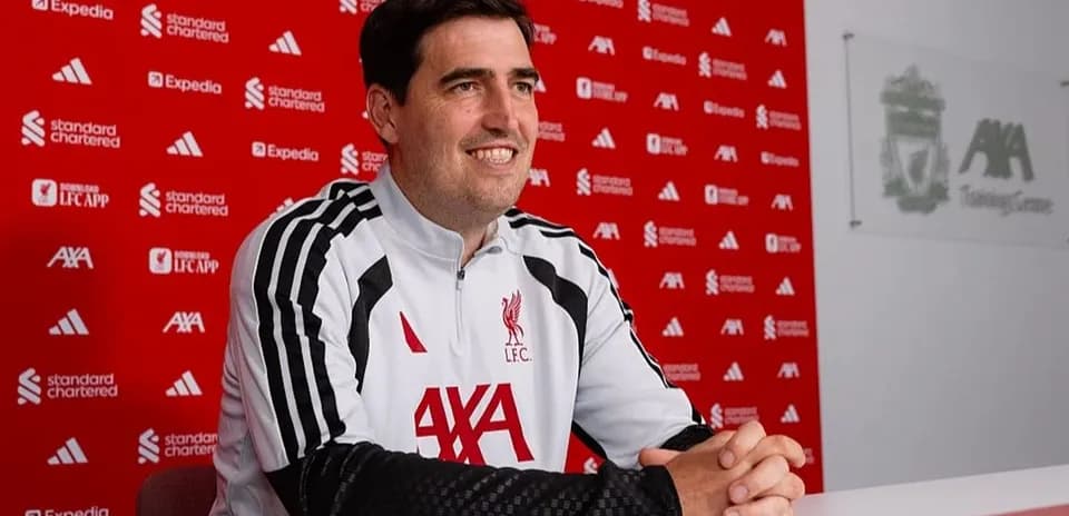 Coach at press conference in training center