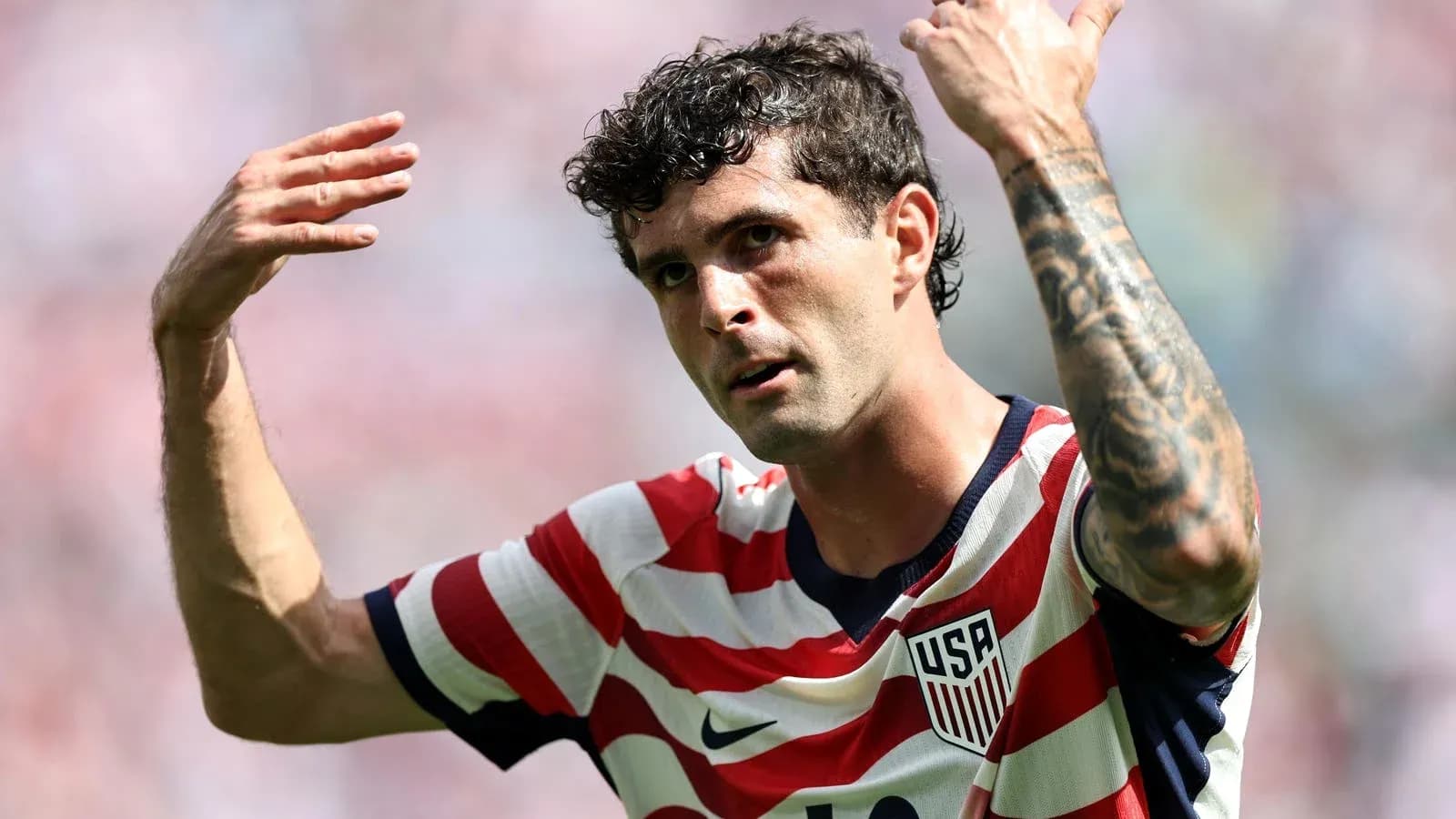 Player gesturing during soccer match for USA team