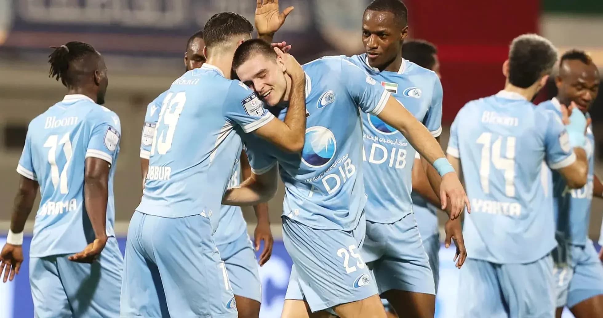 Players celebrating a goal in U23 football match