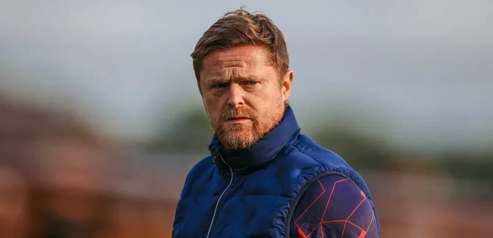 Coach observing the training session on the field