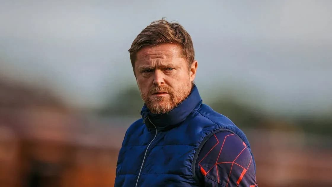 Coach observing the training session on the field