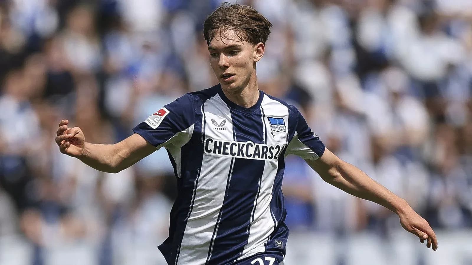 Player in Hertha BSC jersey during match action