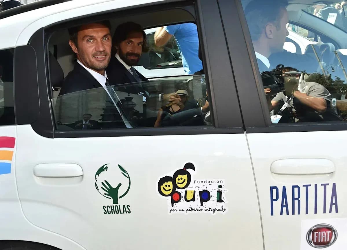 Two men in suits inside a car