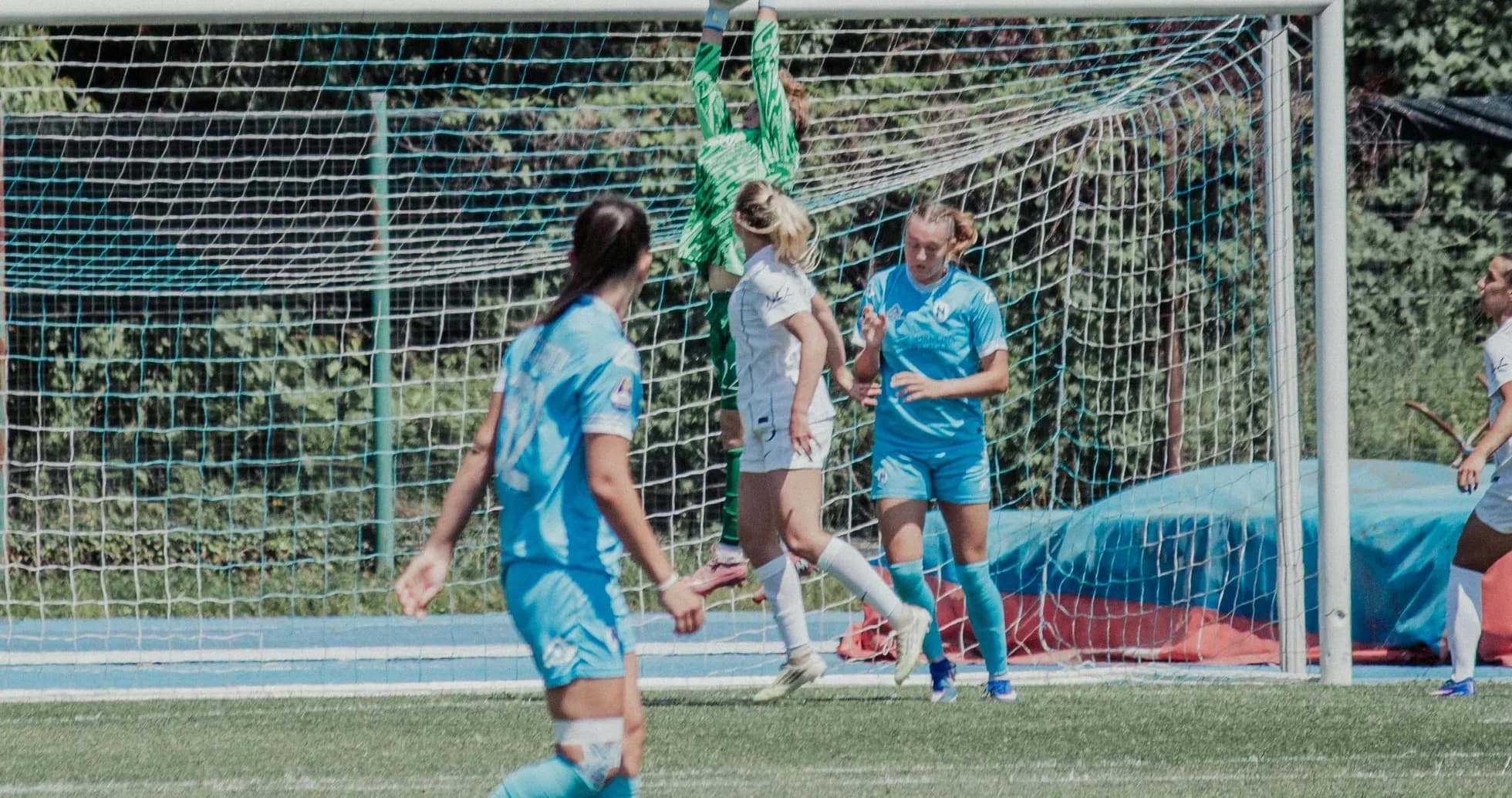 Goalkeeper catching the ball during match