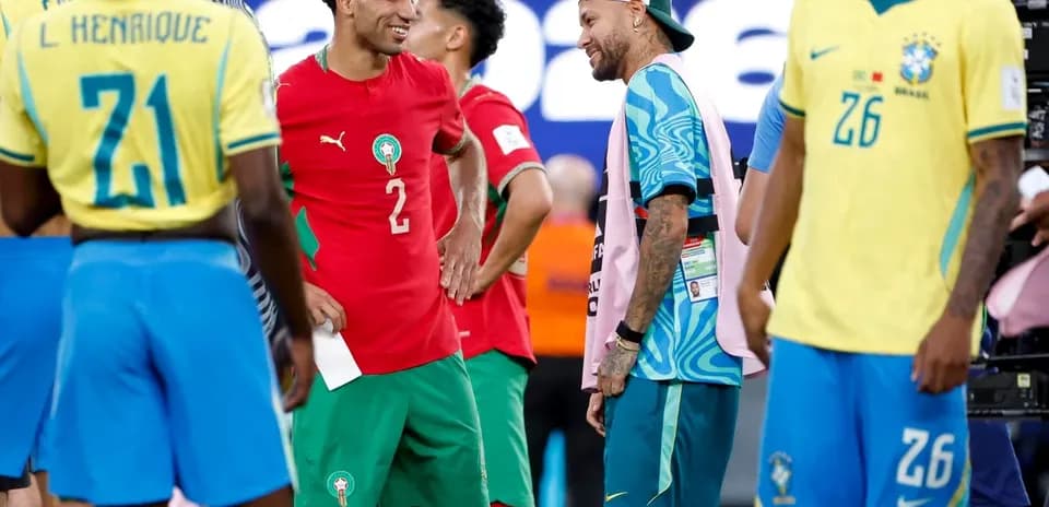 Players from Brazil and Morocco interacting on field