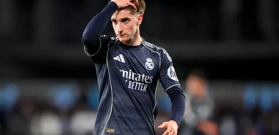 Player in Real Madrid kit walking off the field