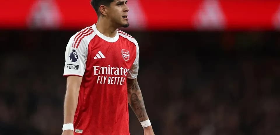 Player in Arsenal kit during match action