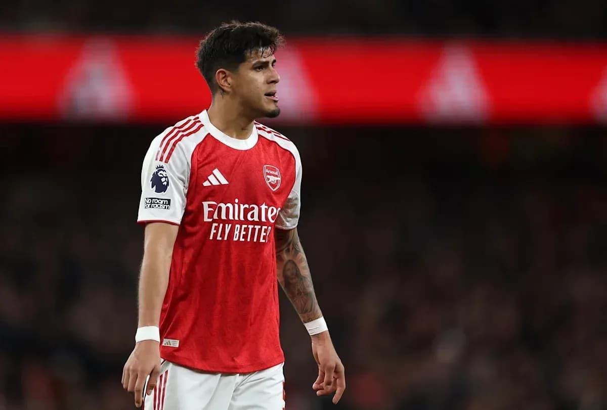 Player in Arsenal kit during match action
