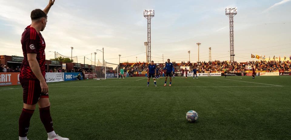 Player preparing for a free kick during match