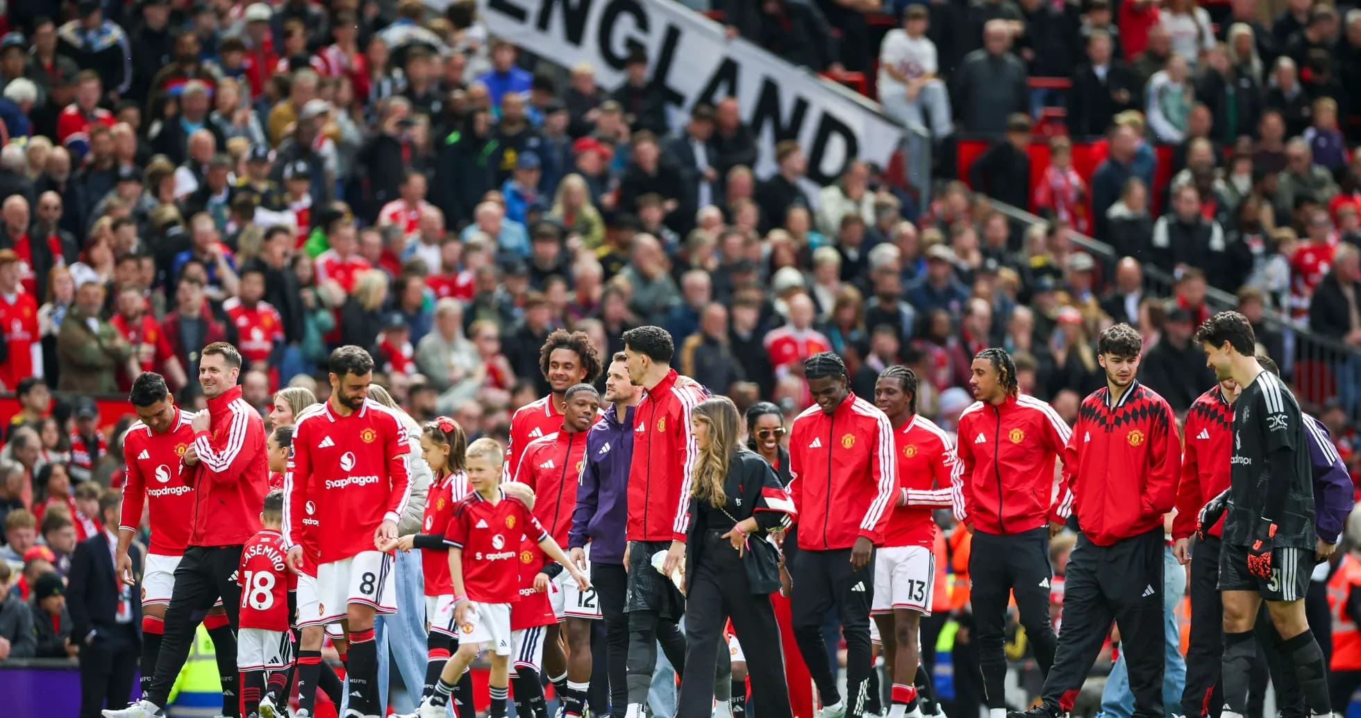 Manchester United players entering the pitch at Old Trafford