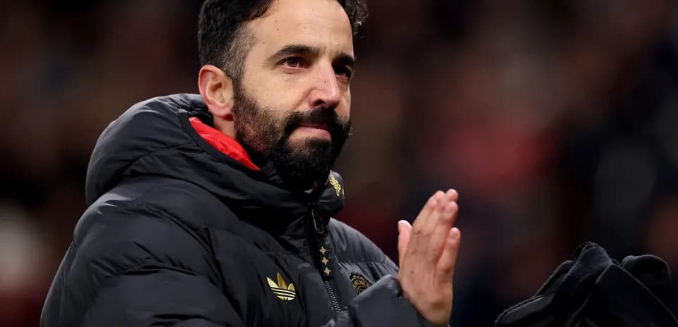 Coach applauding fans after match in stadium