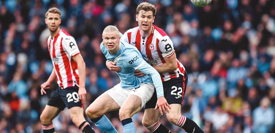 Erling Haaland being challenged during match