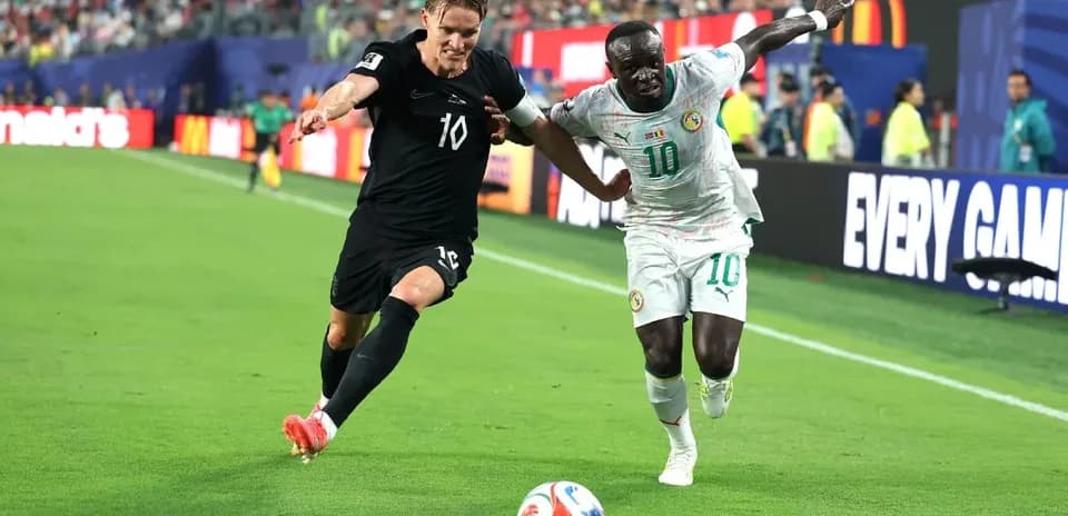 Two players competing for the ball in a match