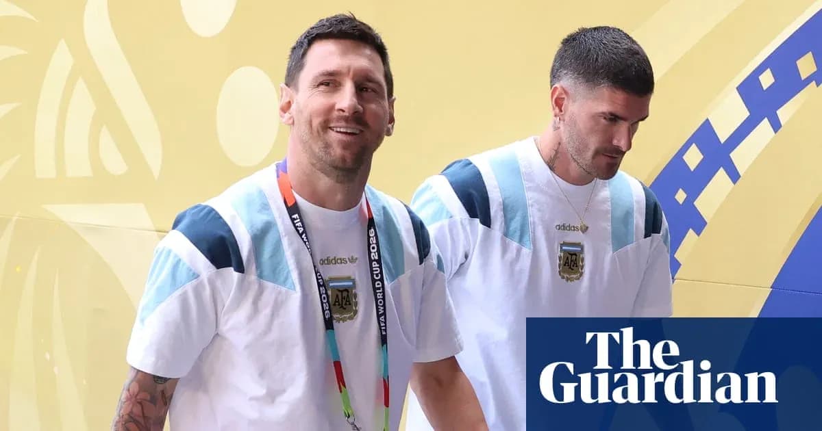 Two players entering venue wearing Argentina jerseys