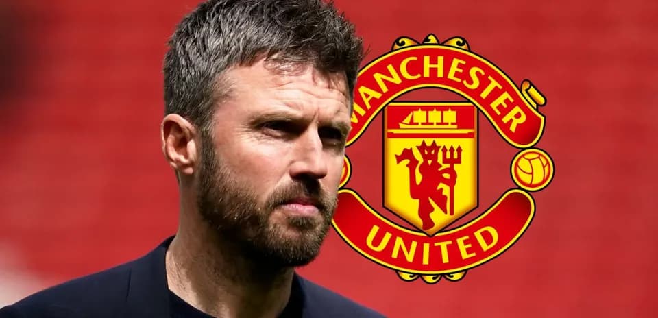 Coach in front of Manchester United logo backdrop