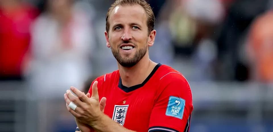 Player applauding while wearing red team jersey