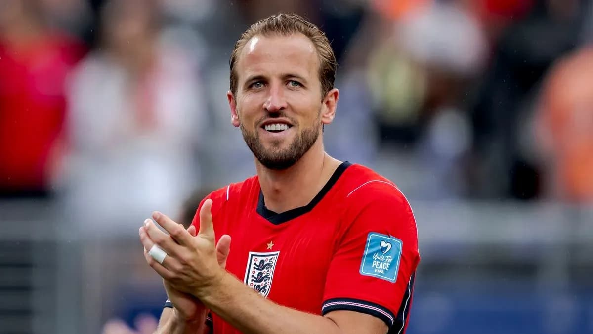 Player applauding while wearing red team jersey