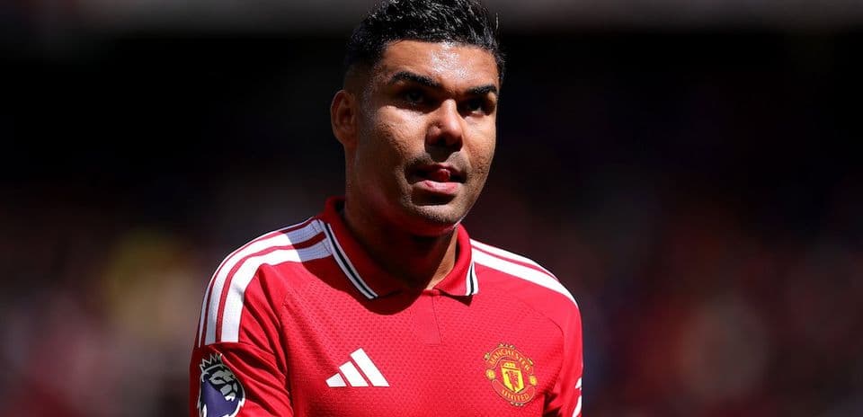 Player in red Manchester United jersey on field