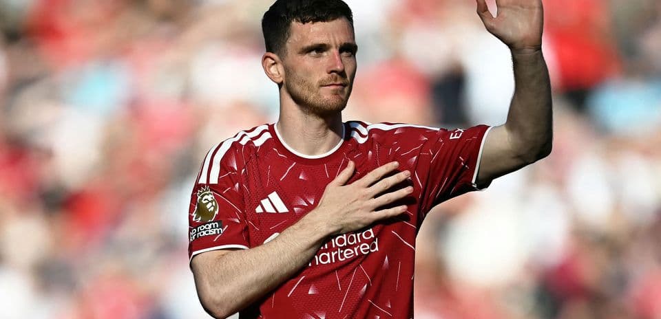Player waving with hand on heart in red jersey