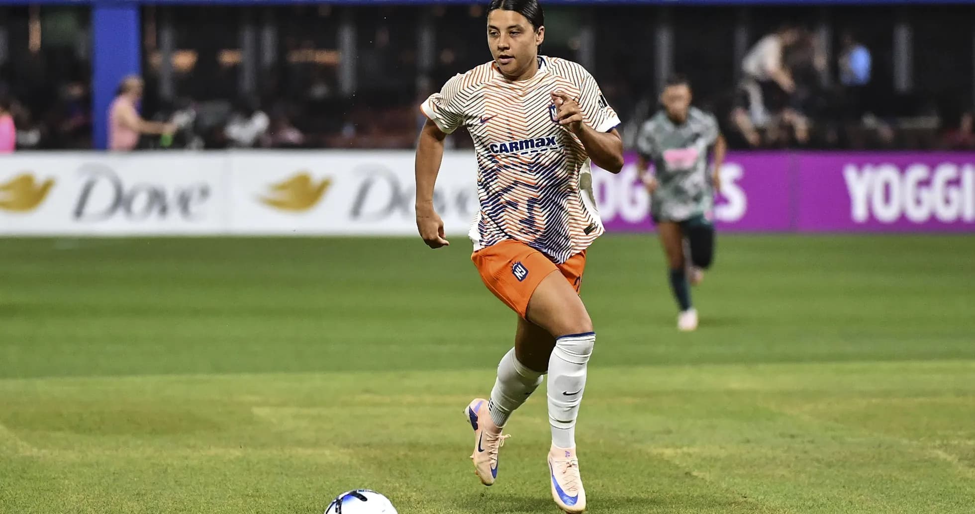 Player sprinting with the ball during match
