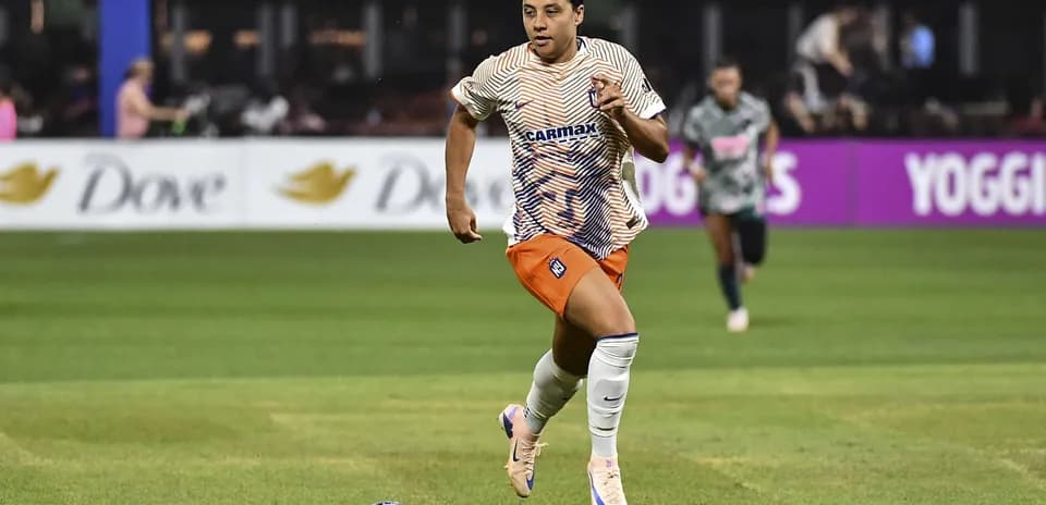 Player sprinting with the ball during match