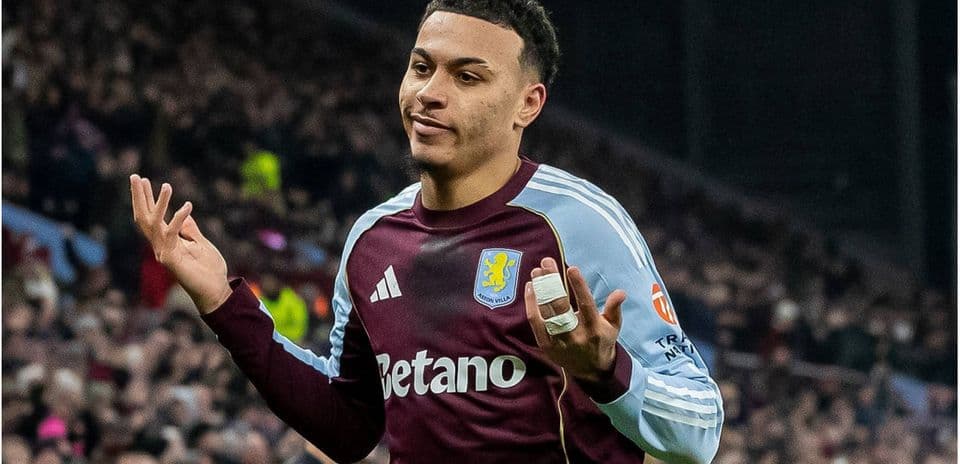Player gesturing during match in Aston Villa kit