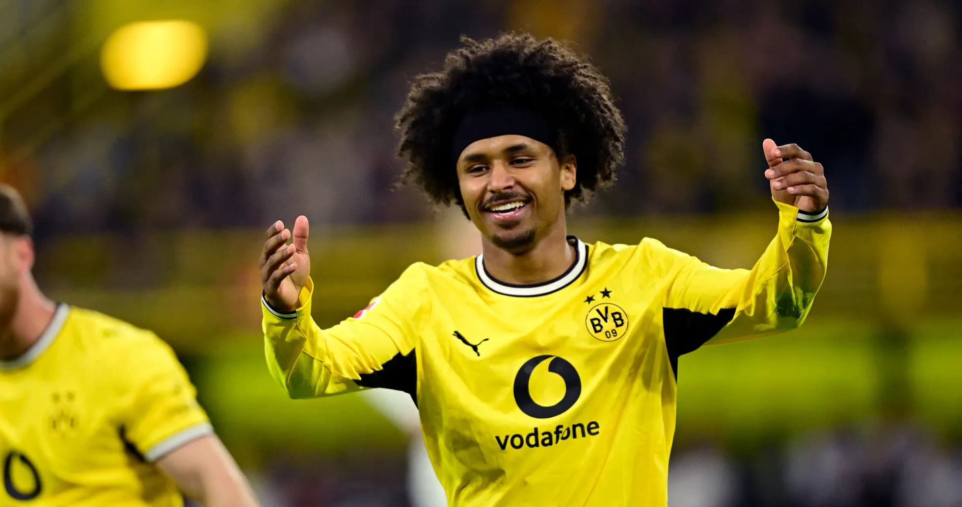 Player celebrating a goal in Borussia Dortmund jersey