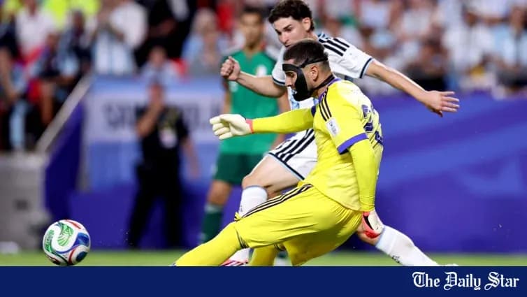 Goalkeeper in yellow uniform blocking a shot