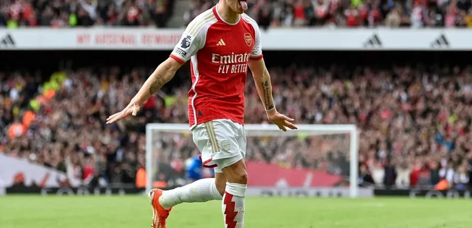 Player celebrating a goal for Arsenal at stadium