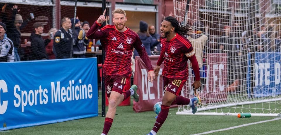 Detroit City players celebrating a goal
