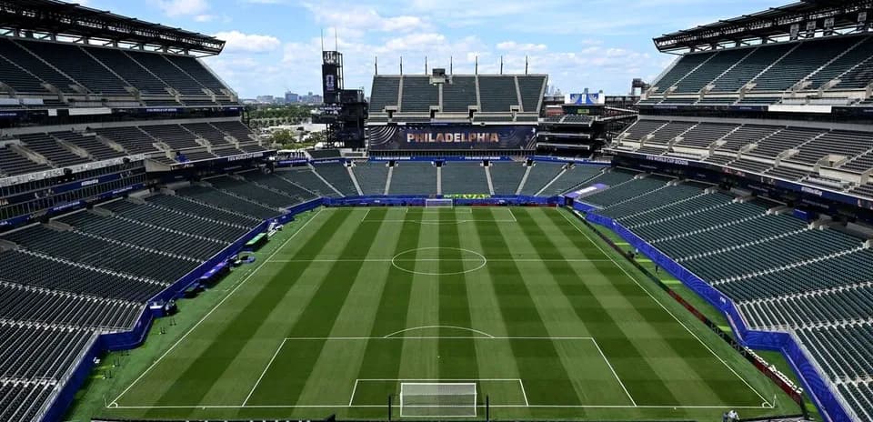 Empty soccer stadium with well-maintained field