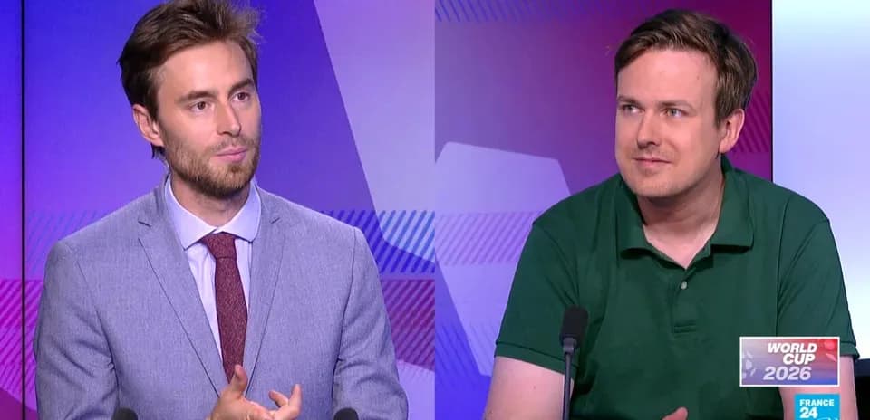 Two commentators discussing World Cup 2026 on set