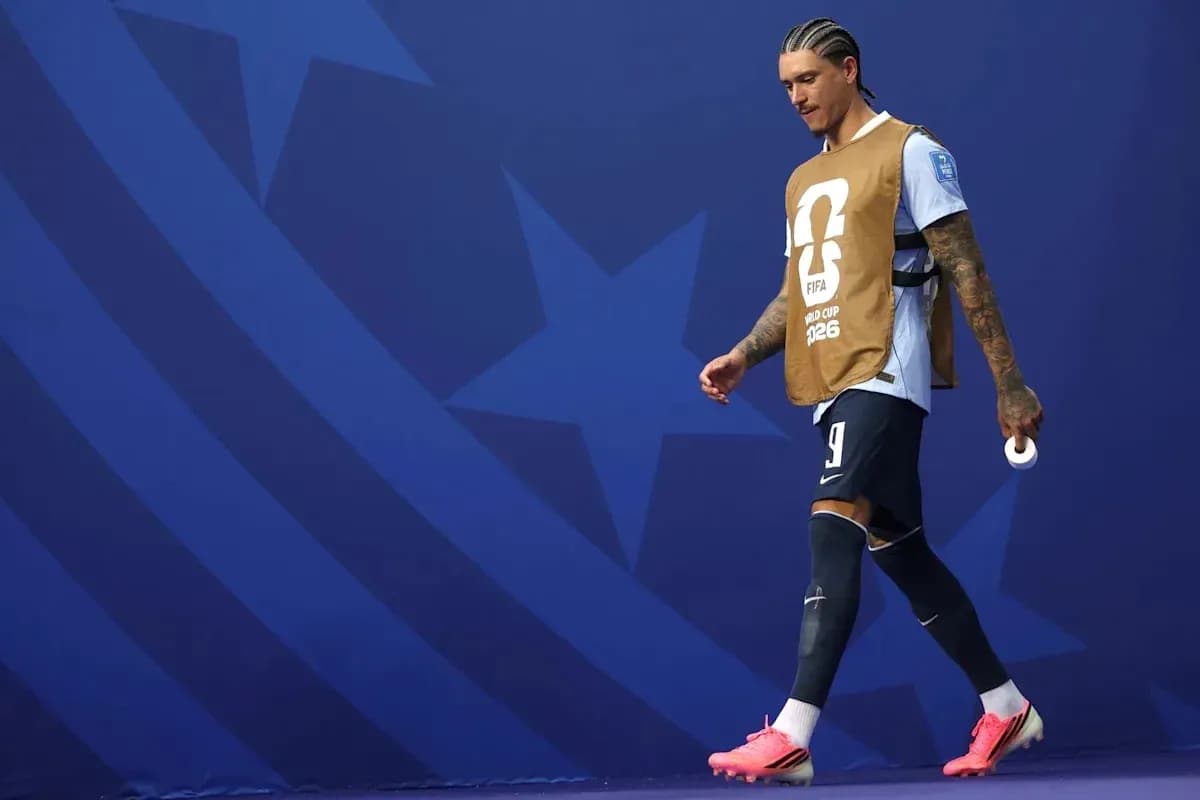 Player walking on the pitch in training bib