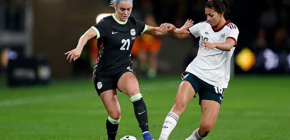 Two players contesting for the ball during match