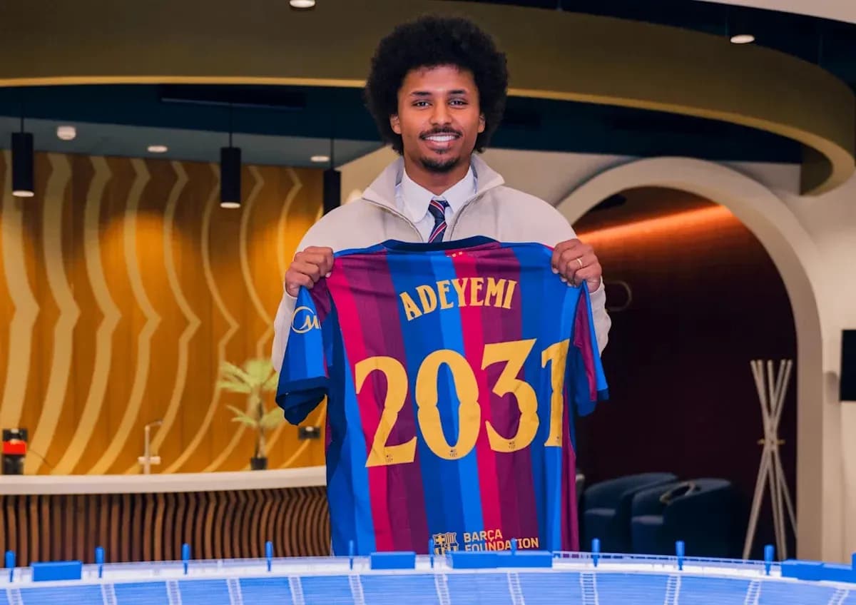 Player holding Barcelona jersey with Adeyemi and 2031