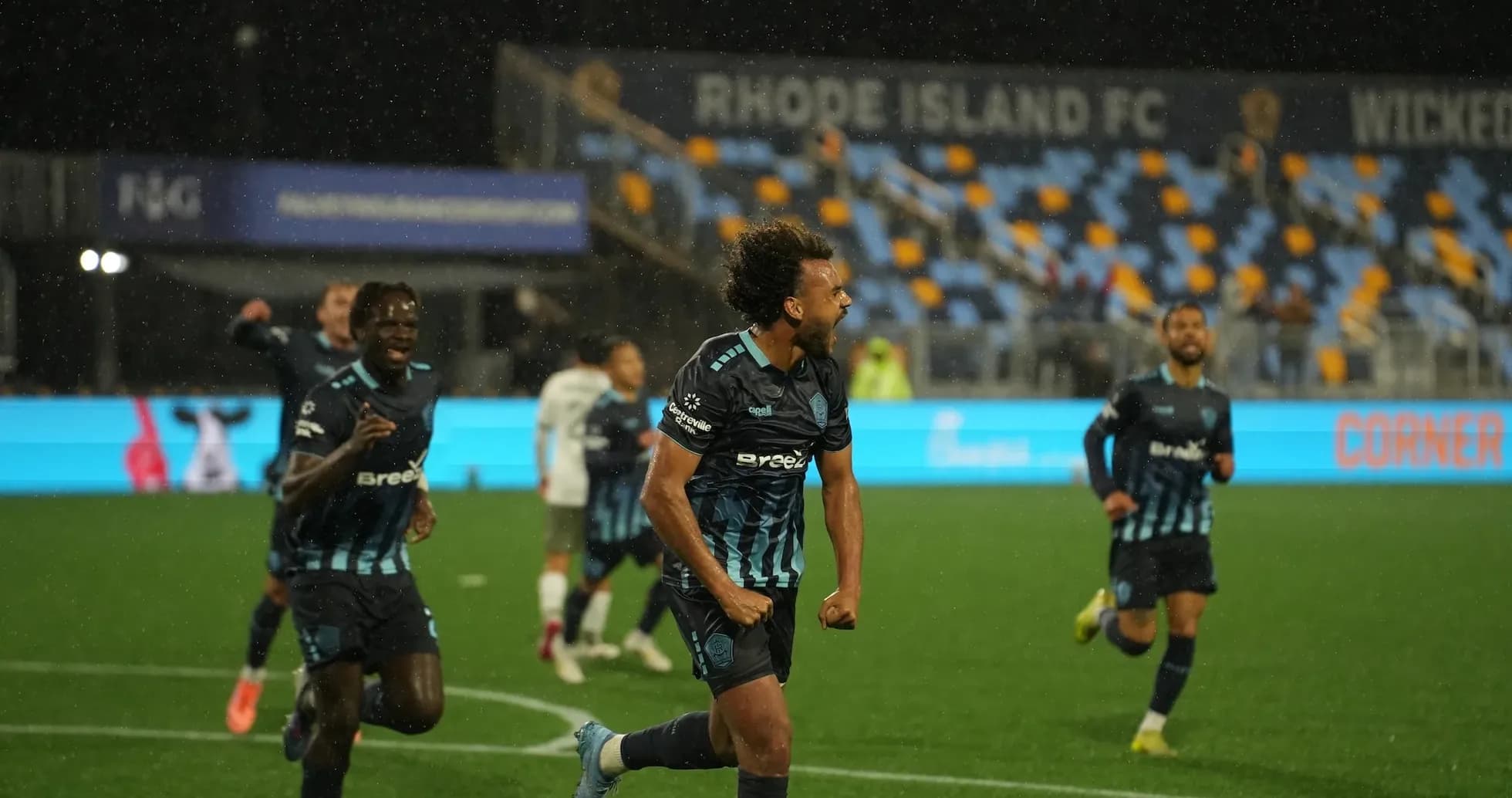 Rhode Island FC players celebrating a goal Rhode Island FC players celebrating a goal