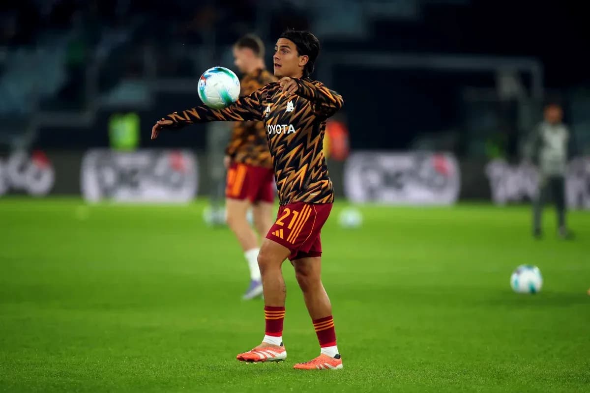 Player warming up and juggling ball during practice Player warming up and juggling ball during practice