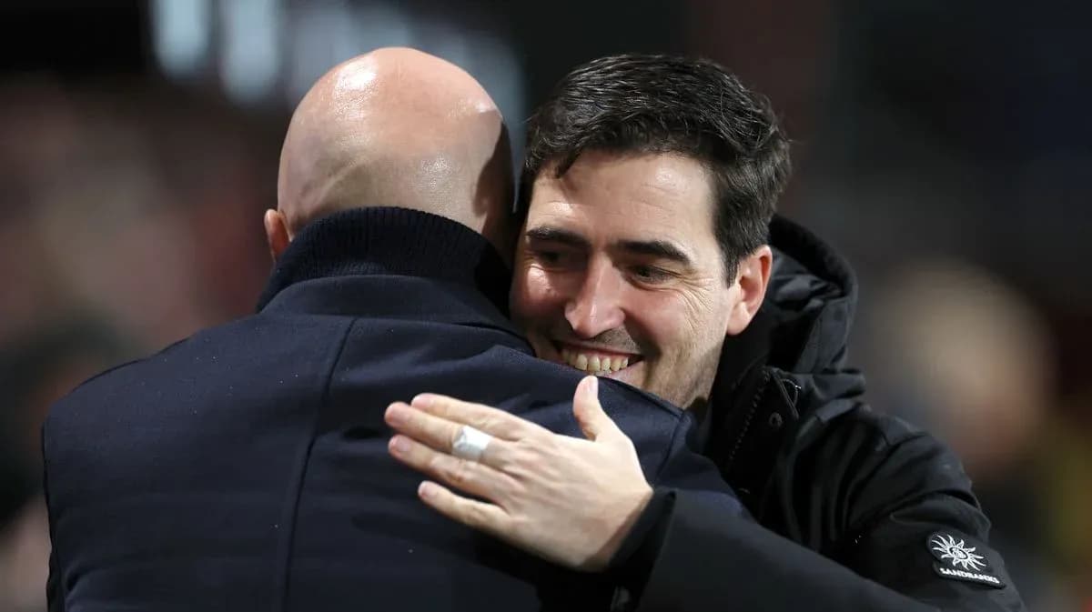 Two coaches embracing after a match Two coaches embracing after a match