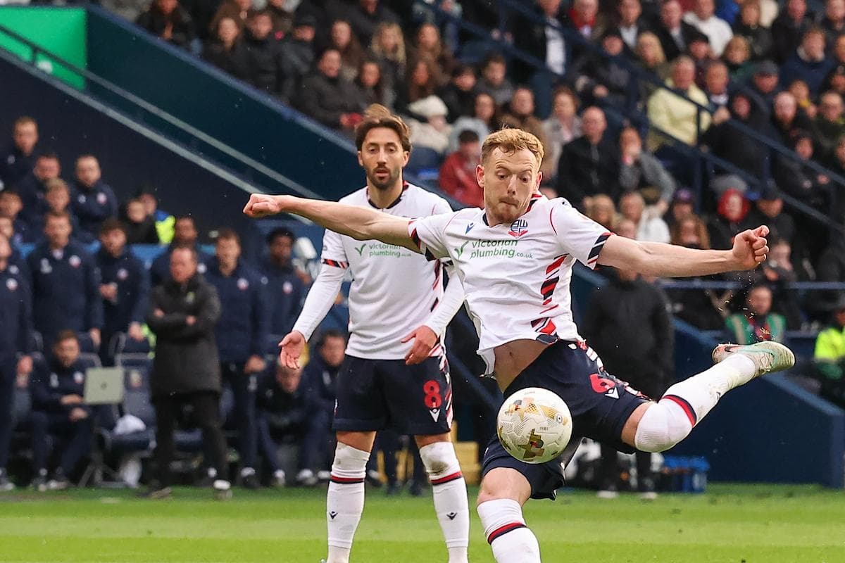 Bolton player kicking ball during match action Bolton player kicking ball during match action