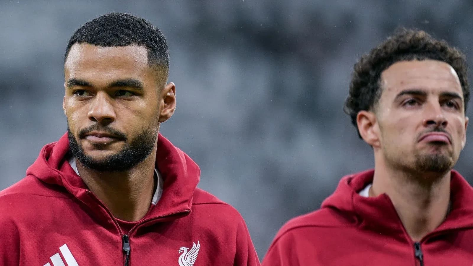 Two Liverpool players in training attire before match Two Liverpool players in training attire before match