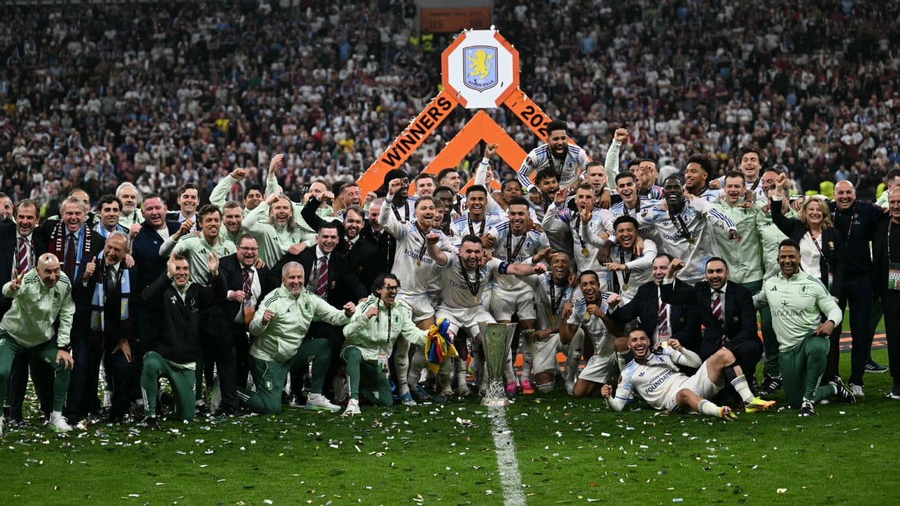 Aston Villa team celebrating with trophy after victory Aston Villa team celebrating with trophy after victory