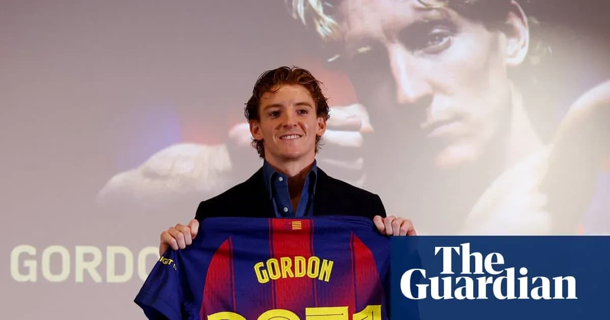 Player holding FC Barcelona jersey at presentation Player holding FC Barcelona jersey at presentation
