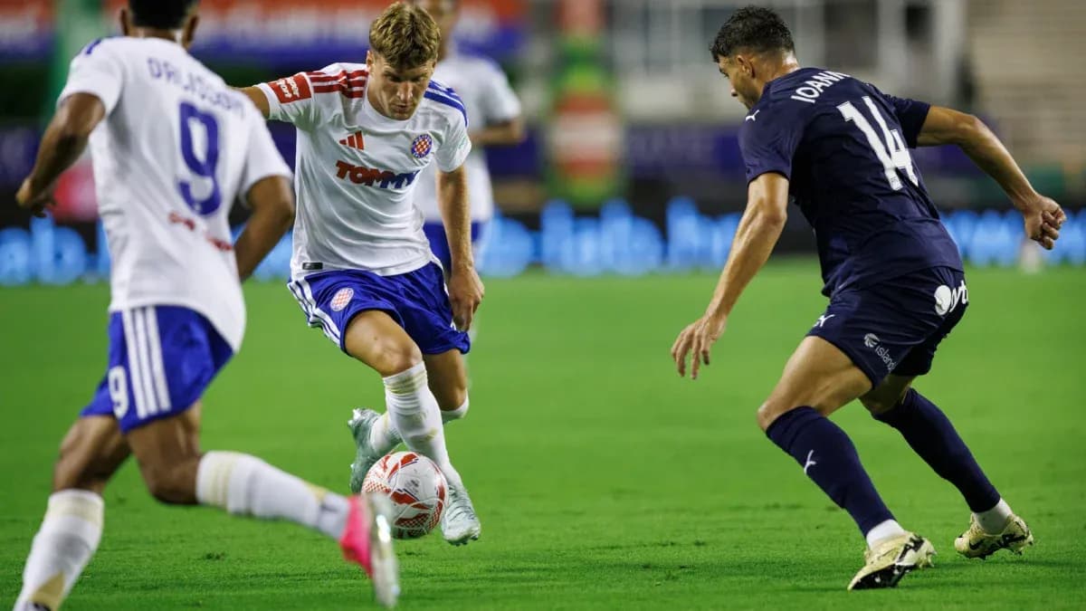 HNK Hajduk Split player dribbling past Pafos defenders HNK Hajduk Split player dribbling past Pafos defenders