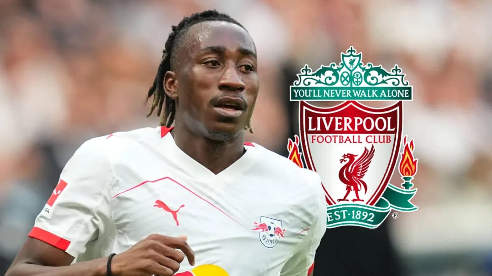 Player running on field with Liverpool logo background Player running on field with Liverpool logo background