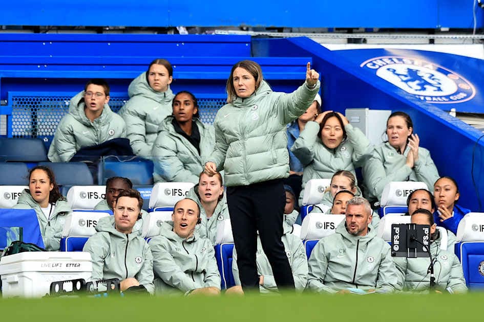 Coach directing players from the sidelines during match Coach directing players from the sidelines during match