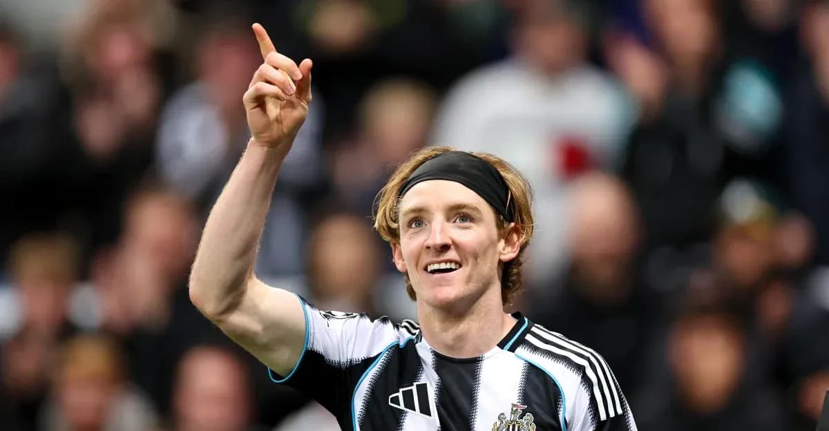 Newcastle player celebrating a goal with raised finger Newcastle player celebrating a goal with raised finger