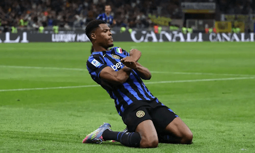 Player celebrating goal on the pitch Player celebrating goal on the pitch