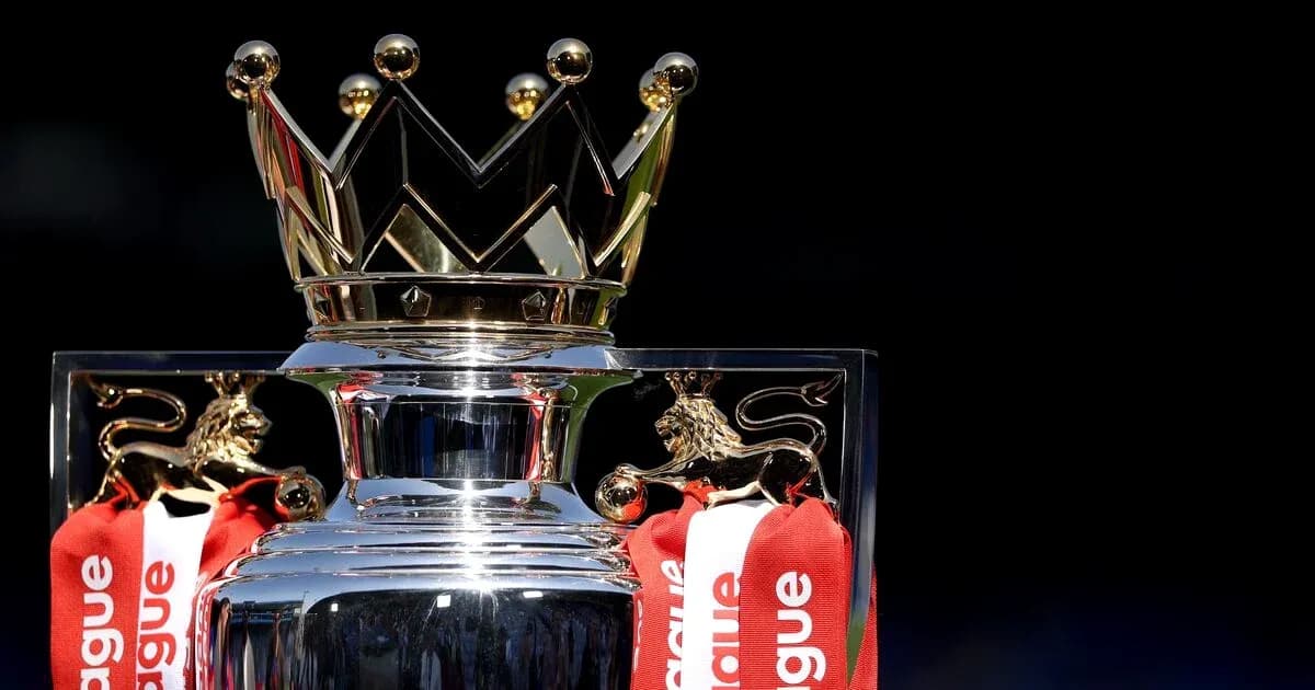 Premier League trophy with red ribbons displayed Premier League trophy with red ribbons displayed